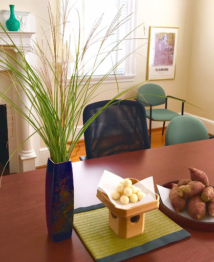 An image of a desk with a plant and food 